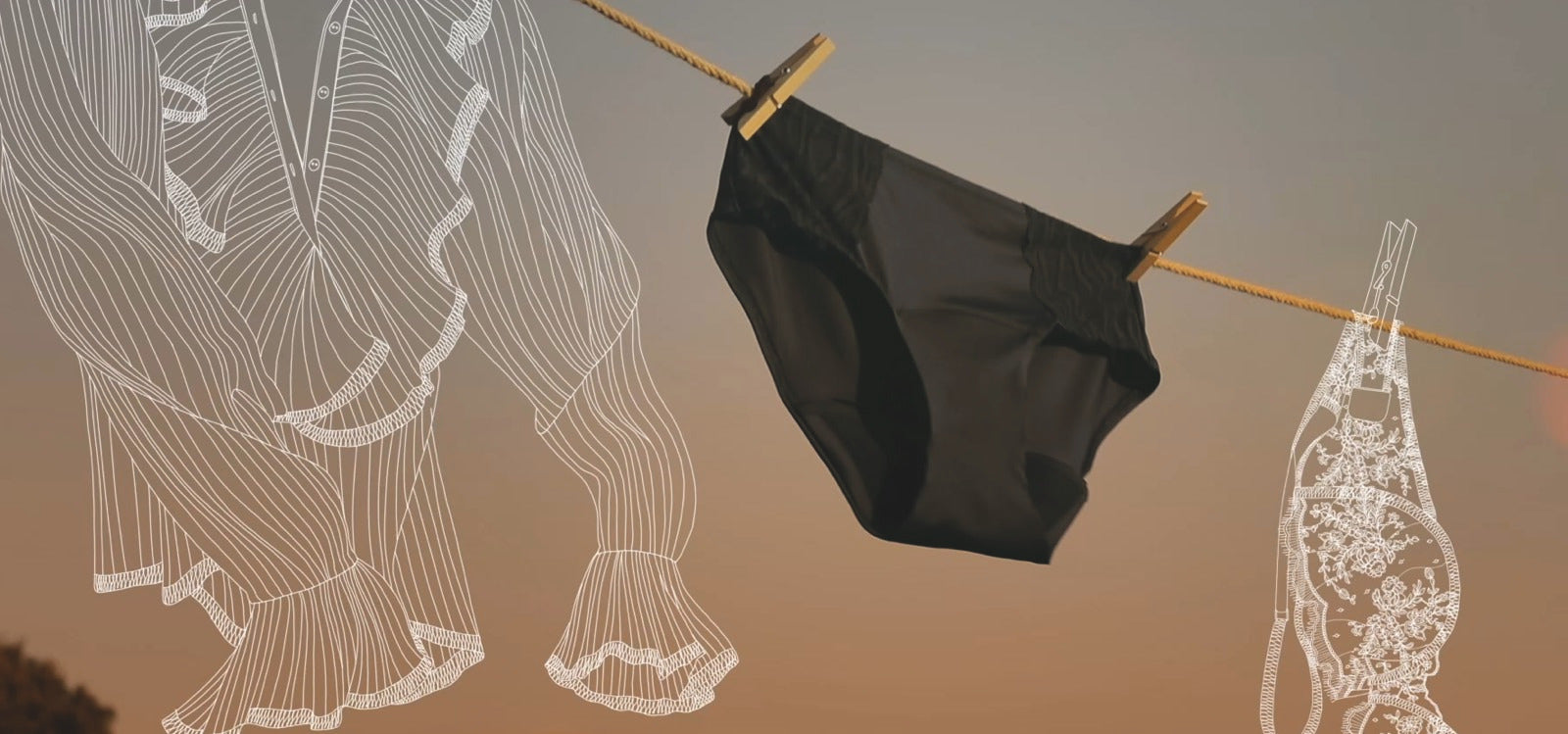 Schützende, waschbare Unterwäsche von TENA auf der Wäscheleine bei Sonnenuntergang