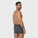 NEUE TENA Men schützende Boxershorts an einem Mann von hinten gezeigt.